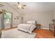 Bright bedroom with ceiling fan, neutral walls, and a large window at 2604 E Chelsea St, Tampa, FL 33610