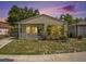 Cozy one-story home with a charming front porch, well-manicured lawn and mature landscaping at 2604 E Chelsea St, Tampa, FL 33610