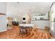 Open-concept living room and kitchen with wood floors and modern finishes at 2604 E Chelsea St, Tampa, FL 33610