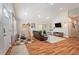 Well-lit living room showcasing hardwood floors, modern decor, and an open layout for entertaining at 2604 E Chelsea St, Tampa, FL 33610