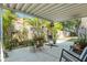 Outdoor patio with concrete floor and metal awning, offering an inviting outdoor space with plants at 2604 E Chelsea St, Tampa, FL 33610