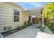 Covered outdoor patio space with a concrete floor, hanging swing, seating and view of yard at 2604 E Chelsea St, Tampa, FL 33610