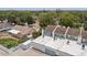 An aerial view of the townhome complex featuring white roofs and blue trim with surrounding residential properties at 3413 W Kirby St, Tampa, FL 33614