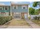 Charming two-story home featuring stone accents and a well-maintained front lawn at 3413 W Kirby St, Tampa, FL 33614