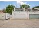 Close-up shows attached garages of the townhomes, with large doors and a parking area at 3413 W Kirby St, Tampa, FL 33614