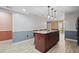 Well-appointed kitchen island with ample counter space and wood cabinets at 3413 W Kirby St, Tampa, FL 33614