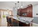 Beautiful kitchen with a marble island, stainless steel appliances, and stylish pendant lighting at 3413 W Kirby St, Tampa, FL 33614