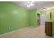 Bright laundry room with tile flooring, green walls, and washer and dryer hookups at 3413 W Kirby St, Tampa, FL 33614