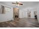Cozy living room featuring a stone fireplace and wood flooring at 3413 W Kirby St, Tampa, FL 33614