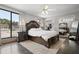 Traditional bedroom featuring a spacious layout, decorative furniture set, plush bed, and an expansive window at 3413 W Kirby St, Tampa, FL 33614