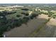 Lovely aerial view of the property highlighting its vast land, mature trees, and serene setting at 3544 Porter Rd, Lithia, FL 33547