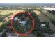 Aerial view of property featuring homes, outbuildings, and surrounding greenery at 3544 Porter Rd, Lithia, FL 33547