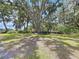 Picturesque backyard with mature trees and open space, perfect for outdoor activities and relaxation at 3544 Porter Rd, Lithia, FL 33547