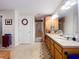 Bathroom featuring a double sink vanity with drawers, a large mirror, and tiled floors at 3544 Porter Rd, Lithia, FL 33547