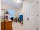 Bright bedroom with a desk, chair, and white trim at 3544 Porter Rd, Lithia, FL 33547