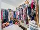 Walk-in closet with ample hanging space, shelves, and storage for clothing and accessories at 3544 Porter Rd, Lithia, FL 33547