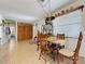 Dining room features a wooden table, tile floors, natural light, and ample closet space at 3544 Porter Rd, Lithia, FL 33547