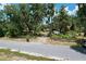 Long gravel driveway leads to the house; lush trees and landscaping provide a tranquil, secluded setting at 3544 Porter Rd, Lithia, FL 33547