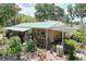 Charming home with a covered porch and lush landscaping, perfect for enjoying the outdoors in a serene setting at 3544 Porter Rd, Lithia, FL 33547