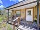 Inviting front porch featuring rustic decor and a welcoming atmosphere with warm tones and a cozy feel at 3544 Porter Rd, Lithia, FL 33547