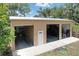 A large three-door garage with ample storage and work space at 3544 Porter Rd, Lithia, FL 33547