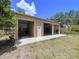 Spacious three-bay garage with concrete flooring and ample storage space at 3544 Porter Rd, Lithia, FL 33547