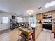 Functional kitchen with tile flooring, light oak cabinets, and a view into the dining area, great for entertaining at 3544 Porter Rd, Lithia, FL 33547