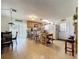 Spacious kitchen area with tile flooring, a central island, wooden cabinets, and stainless steel appliances at 3544 Porter Rd, Lithia, FL 33547