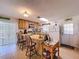 Cozy kitchen with a breakfast bar, tile floors, oak cabinets, and neutral countertops; perfect for casual dining at 3544 Porter Rd, Lithia, FL 33547
