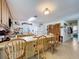 Inviting kitchen featuring tile floors, light oak cabinets, breakfast bar, and a view of the adjoining rooms at 3544 Porter Rd, Lithia, FL 33547