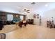 Large living room with tile floors, recessed lighting, ceiling fan, and ample seating with a brick accent wall at 3544 Porter Rd, Lithia, FL 33547