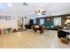 Bright living area with tile flooring, ample seating, and natural light filtering through the windows at 3544 Porter Rd, Lithia, FL 33547