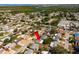 Expansive aerial view of a quiet residential neighborhood with lush greenery and waterfront access at 3640 Cheswick Dr, Holiday, FL 34691