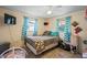Cozy bedroom with natural light, comfortable bed, and charming decor accents at 3640 Cheswick Dr, Holiday, FL 34691