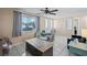 Bright and open living room featuring tile floors, large windows, and comfortable seating at 3640 Cheswick Dr, Holiday, FL 34691