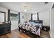 Stylish bedroom with dark wood floors, ceiling fan, and plenty of natural light at 3640 Cheswick Dr, Holiday, FL 34691
