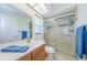 Bright bathroom with a glass-enclosed shower, modern vanity, and neutral finishes at 368 Perth Ct # 368, Dunedin, FL 34698
