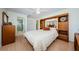Spacious bedroom with built-in storage, a queen bed, and a ceiling fan for added comfort at 368 Perth Ct # 368, Dunedin, FL 34698