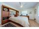 Inviting bedroom with hardwood floors, built-in storage, and a cozy bed at 368 Perth Ct # 368, Dunedin, FL 34698