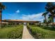 Community clubhouse with covered picnic area overlooking manicured landscaping, creating a serene outdoor space at 368 Perth Ct # 368, Dunedin, FL 34698