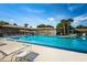 A community pool and recreational area with lounge chairs, perfect for relaxation and leisure at 368 Perth Ct # 368, Dunedin, FL 34698