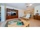 Inviting living room with stylish furniture, a decorative rug, and views into the dining area at 368 Perth Ct # 368, Dunedin, FL 34698