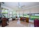 Bright sunroom with large windows, tile flooring, and inviting seating, perfect for relaxation at 368 Perth Ct # 368, Dunedin, FL 34698