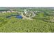Aerial view pinpointing the location of a home within a beautiful, lake-filled community at 3713 Lonewood Ct, Land O Lakes, FL 34638