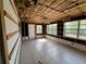 Spacious living room with three windows and tile flooring partially under construction at 378 79Th Ne Ave, St Petersburg, FL 33702