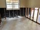 View of a wall with exposed studs ready for renovation, under a window at 378 79Th Ne Ave, St Petersburg, FL 33702
