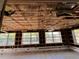 Spacious living room with three windows and tile flooring partially under construction at 378 79Th Ne Ave, St Petersburg, FL 33702