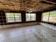 Spacious living room with three windows and tile flooring partially under construction at 378 79Th Ne Ave, St Petersburg, FL 33702