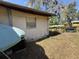 View of the exterior of the back of the home, featuring a yard at 37810 Silver Pines Ave, Zephyrhills, FL 33542