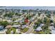 An aerial view of a charming waterfront neighborhood showcases the property's desirable coastal location at 3843 Neptune Se Dr, St Petersburg, FL 33705